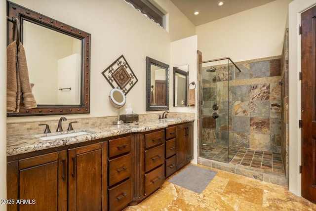 bathroom with vanity and a shower with shower door