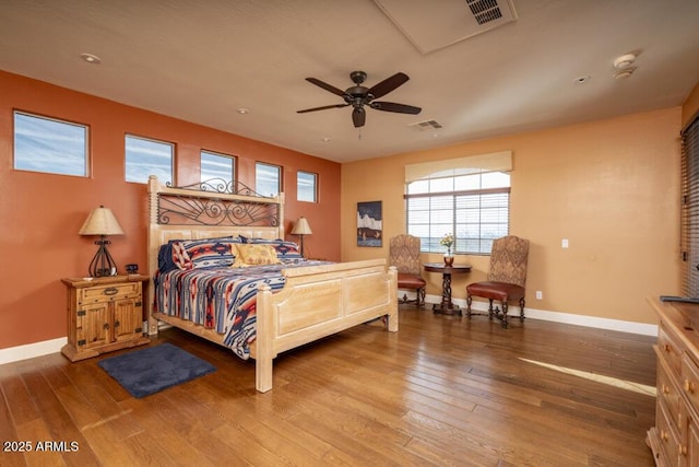 bedroom with hardwood / wood-style floors and ceiling fan