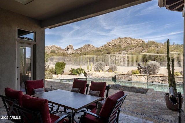 view of patio / terrace with a fenced in pool