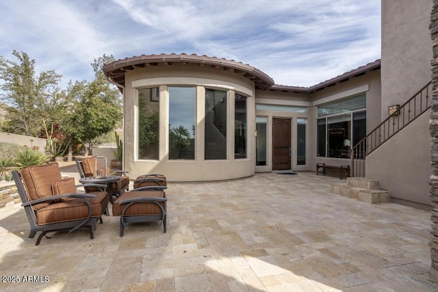 view of patio featuring an outdoor fire pit