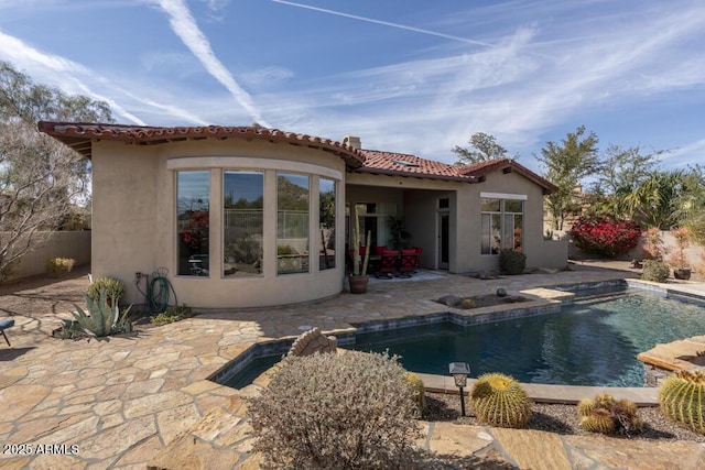 rear view of house with a patio