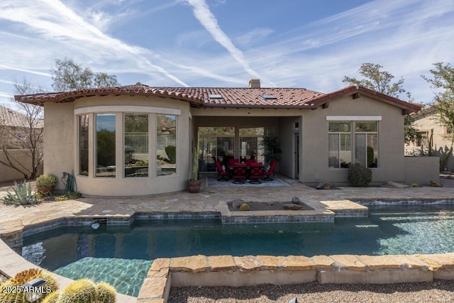 back of property with a patio area