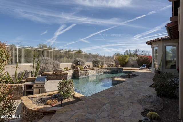 view of swimming pool with area for grilling and a patio