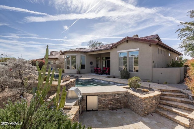 back of house with a patio and area for grilling