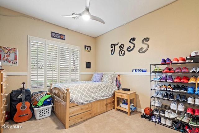 carpeted bedroom with ceiling fan