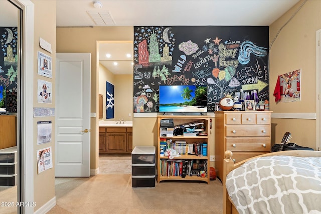 bedroom featuring light carpet and sink