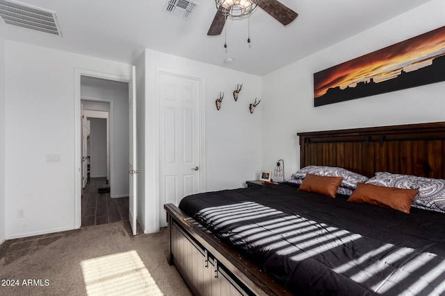 bedroom with ceiling fan and carpet floors