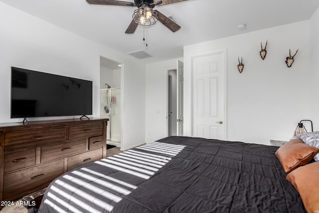 bedroom with ceiling fan and ensuite bath