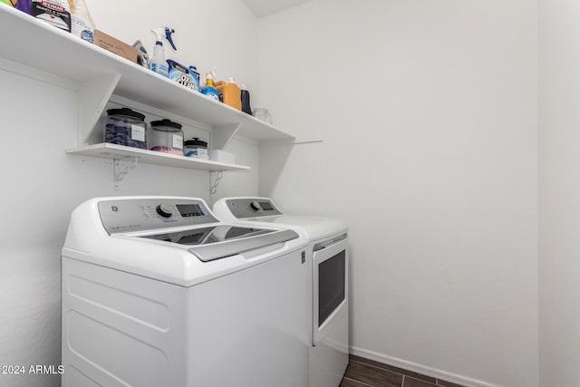 washroom featuring washer and clothes dryer and dark wood-type flooring