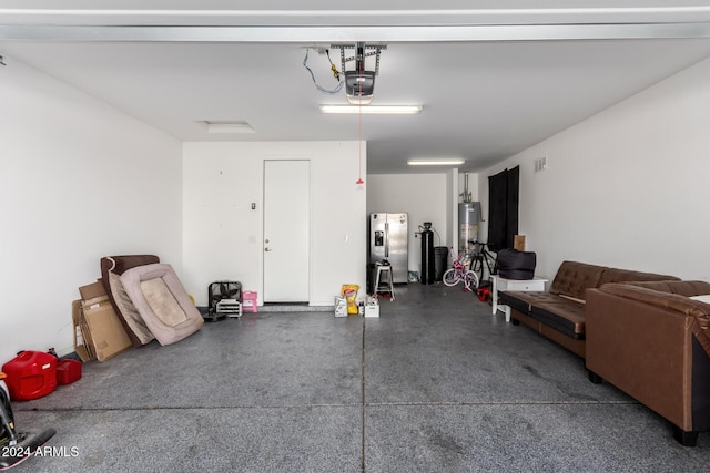 garage featuring stainless steel fridge, water heater, and a garage door opener