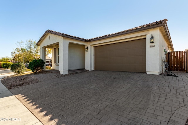 mediterranean / spanish house with a garage