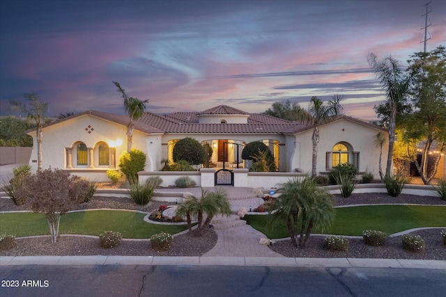 4547 S Banning Dr, Gilbert, AZ 85297 - view of front of home with stucco siding, a lawn, and a tile roof