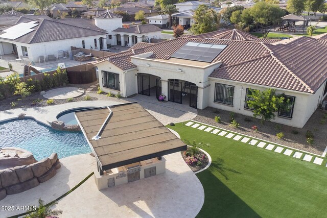 4547 S Banning Dr, Gilbert, AZ 85297 - rear view of property with a residential view, a fenced backyard, a patio area, and a tile roof