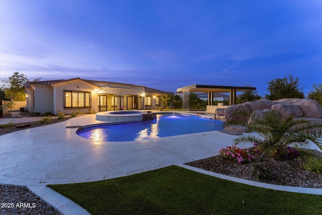 4547 S Banning Dr, Gilbert, AZ 85297 - pool at dusk with a patio area and a pool with connected hot tub