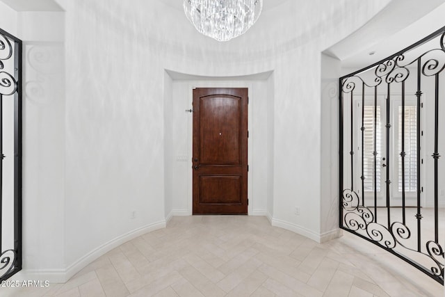 4547 S Banning Dr, Gilbert, AZ 85297 - entryway featuring baseboards and an inviting chandelier