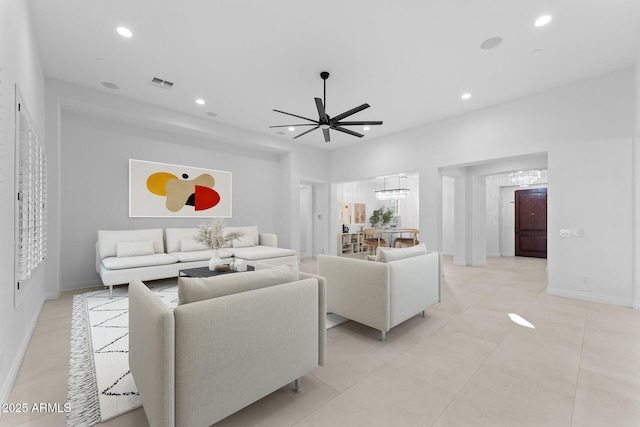 4547 S Banning Dr, Gilbert, AZ 85297 - living area featuring ceiling fan with notable chandelier, light tile patterned floors, visible vents, recessed lighting, and baseboards