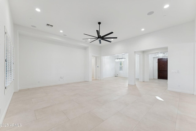 4547 S Banning Dr, Gilbert, AZ 85297 - empty room with visible vents, baseboards, light tile patterned floors, recessed lighting, and ceiling fan with notable chandelier