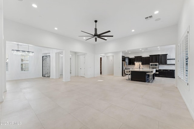 4547 S Banning Dr, Gilbert, AZ 85297 - living room with visible vents, recessed lighting, light tile patterned floors, and ceiling fan with notable chandelier