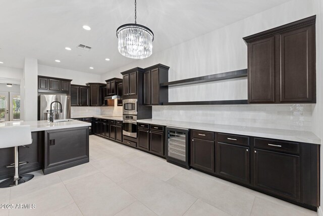 4547 S Banning Dr, Gilbert, AZ 85297 - kitchen featuring open shelves, stainless steel refrigerator with ice dispenser, a notable chandelier, light countertops, and wine cooler