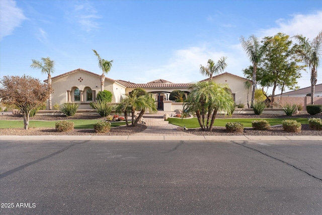 4547 S Banning Dr, Gilbert, AZ 85297 - mediterranean / spanish house featuring a tiled roof, an attached garage, driveway, and stucco siding