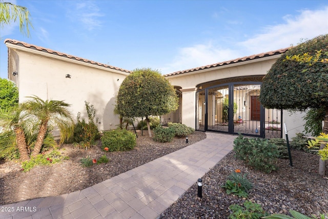 4547 S Banning Dr, Gilbert, AZ 85297 - entrance to property featuring stucco siding, fence, a tile roof, and a gate