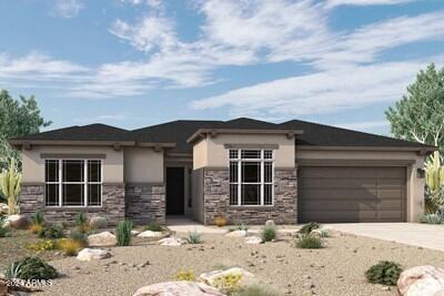 prairie-style home with stone siding, driveway, an attached garage, and stucco siding