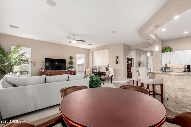 dining room featuring ceiling fan and plenty of natural light