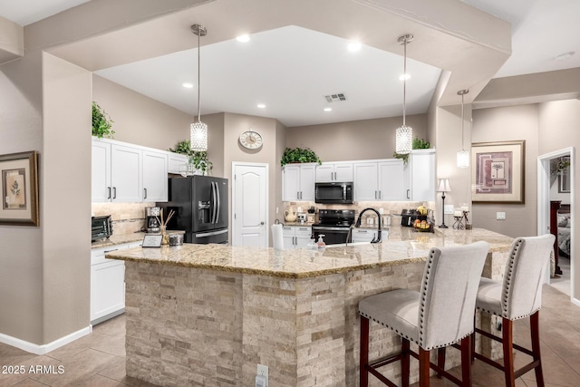 kitchen featuring white cabinetry, range with electric cooktop, kitchen peninsula, and black refrigerator with ice dispenser