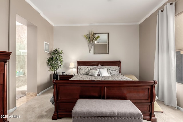 bedroom with crown molding, light colored carpet, and connected bathroom