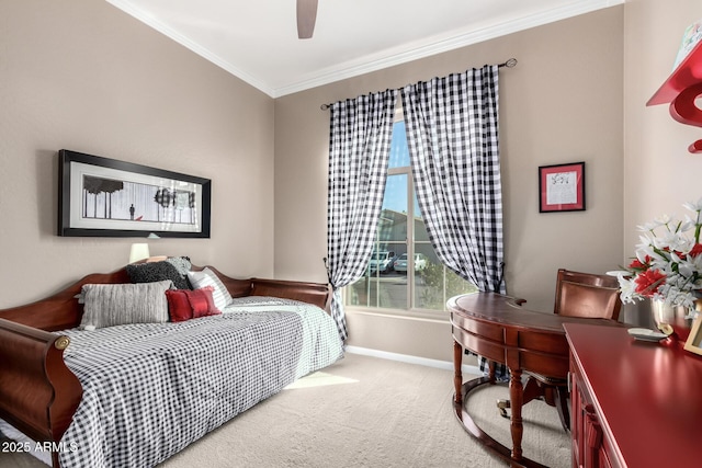 carpeted bedroom with crown molding and ceiling fan