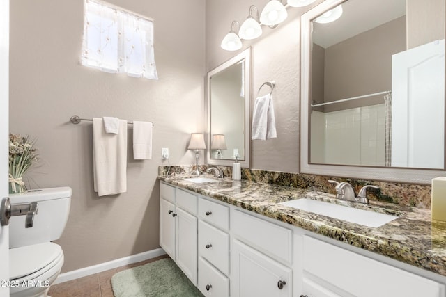 bathroom featuring tile patterned floors, toilet, a shower with shower curtain, and vanity