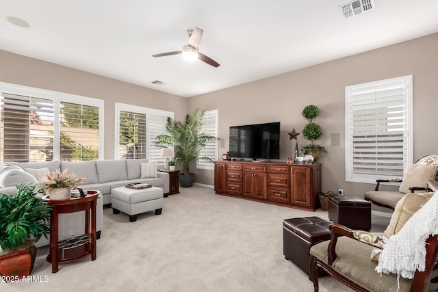 living room featuring ceiling fan and light carpet