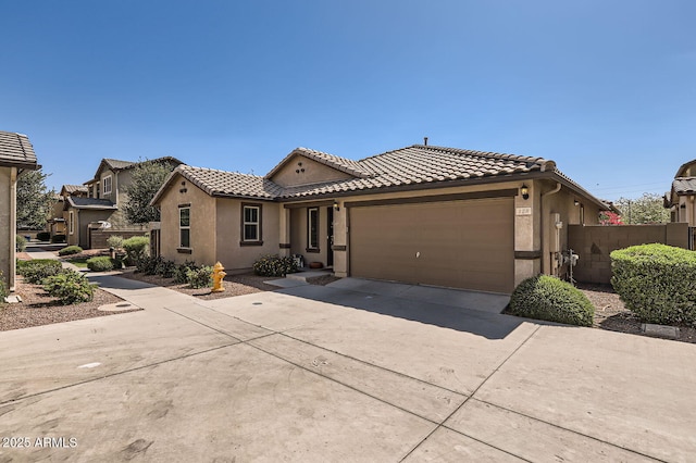 128 E Bluejay Dr, Chandler, AZ 85286 - view of front facade with a tile roof, stucco siding, and driveway