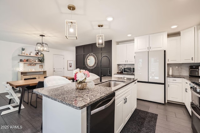 128 E Bluejay Dr, Chandler, AZ 85286 - kitchen featuring freestanding refrigerator, dishwashing machine, a sink, decorative backsplash, and white cabinets