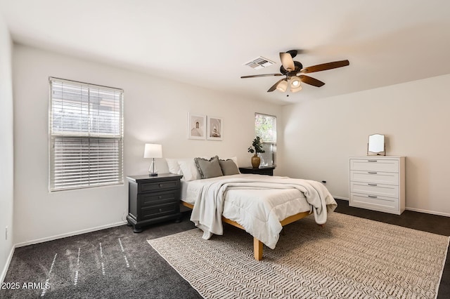 128 E Bluejay Dr, Chandler, AZ 85286 - bedroom featuring dark colored carpet, baseboards, and a ceiling fan