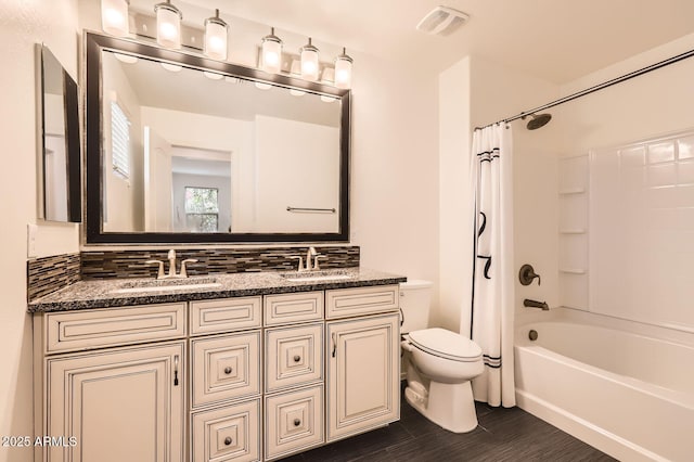 128 E Bluejay Dr, Chandler, AZ 85286 - full bathroom featuring toilet, double vanity, and shower / bath combo