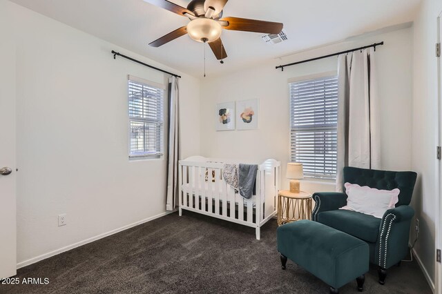 128 E Bluejay Dr, Chandler, AZ 85286 - bedroom with a nursery area, dark carpet, baseboards, and a ceiling fan