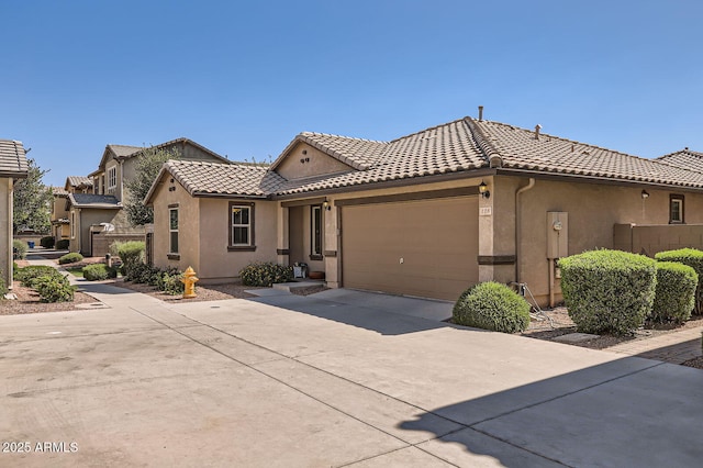 128 E Bluejay Dr, Chandler, AZ 85286 - view of front of house with a tile roof, stucco siding, a garage, and driveway