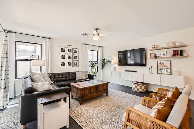 128 E Bluejay Dr, Chandler, AZ 85286 - living room with plenty of natural light, ceiling fan, and dark wood-style flooring