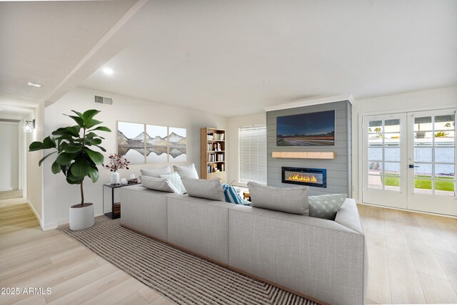 6739 E Thunderbird Rd, Scottsdale, AZ 85254 - living room with a large fireplace, visible vents, baseboards, light wood-type flooring, and recessed lighting
