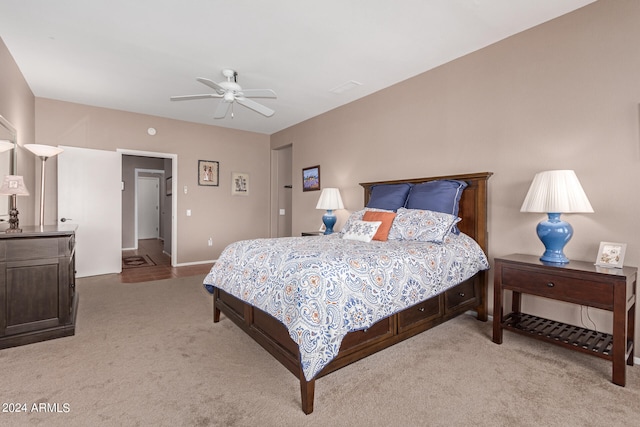 bedroom featuring ceiling fan and light colored carpet