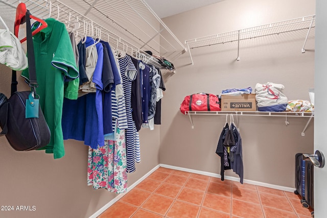 spacious closet featuring tile patterned floors