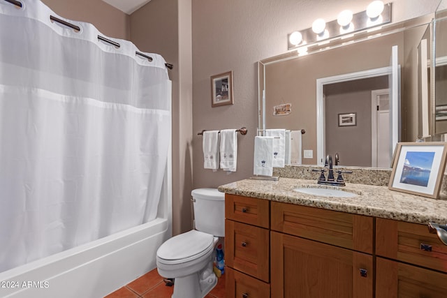 full bathroom with tile patterned flooring, vanity, toilet, and shower / bath combo with shower curtain