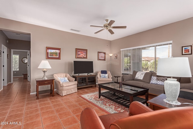 tiled living room featuring ceiling fan