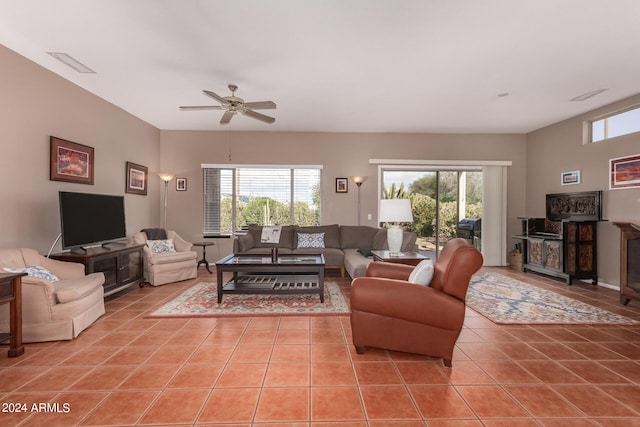 living room with ceiling fan and light tile patterned flooring