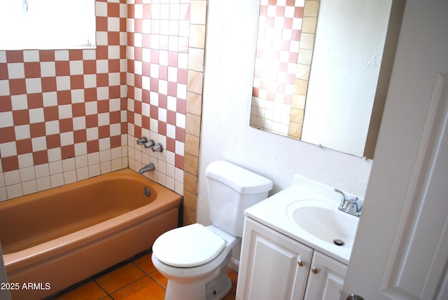 bathroom featuring vanity, toilet, tile patterned flooring, and shower / washtub combination