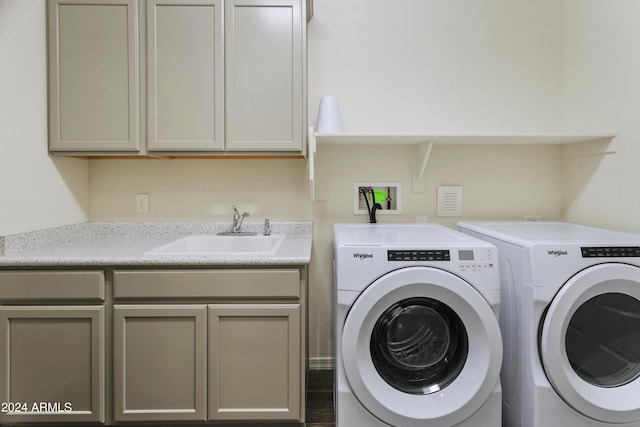 7180 W Tombstone Trl, Peoria, AZ 85383 - clothes washing area featuring independent washer and dryer and cabinet space