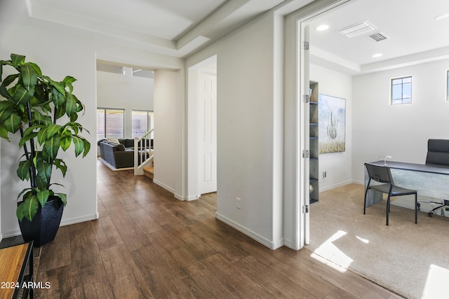 7180 W Tombstone Trl, Peoria, AZ 85383 - home office featuring a tray ceiling, wood finished floors, recessed lighting, and baseboards