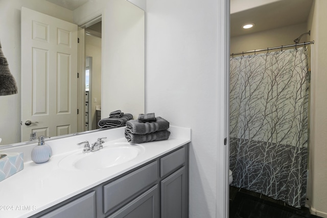 7180 W Tombstone Trl, Peoria, AZ 85383 - bathroom with vanity, toilet, curtained shower, and recessed lighting