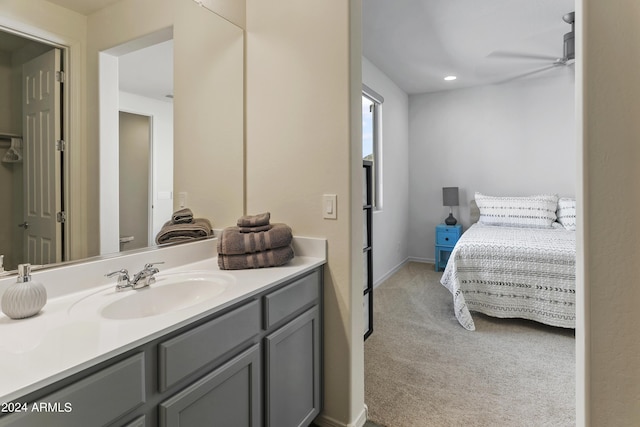 7180 W Tombstone Trl, Peoria, AZ 85383 - bathroom with a ceiling fan, vanity, and recessed lighting